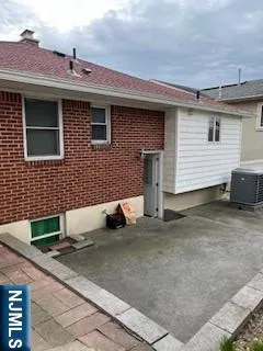 a view of a house with a yard and a garage