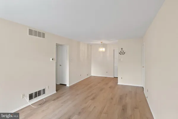 an empty room with wooden floor