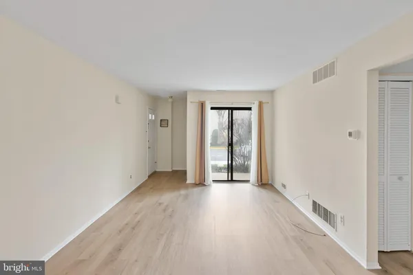 a kitchen with a sink a refrigerator and a stove