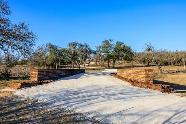 a view of residential houses with snow and trees