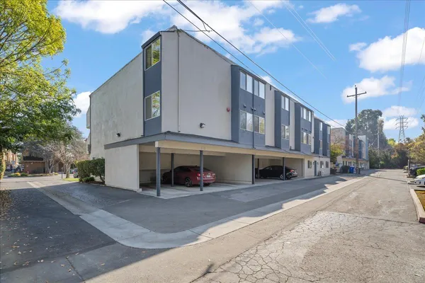 a view of a house with a large space in front of it