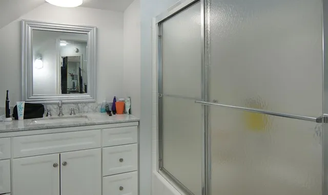 a bathroom with a sink and a mirror