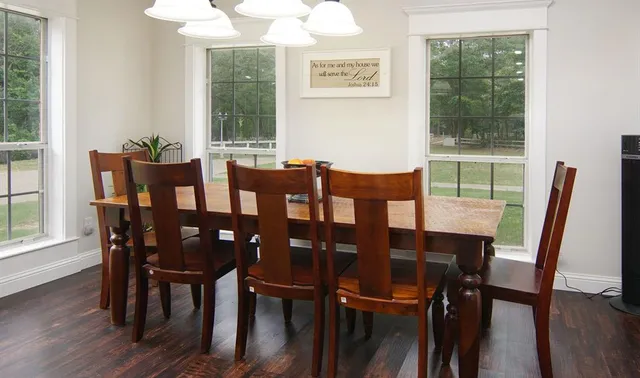 a view of a dining room with furniture window and outside view