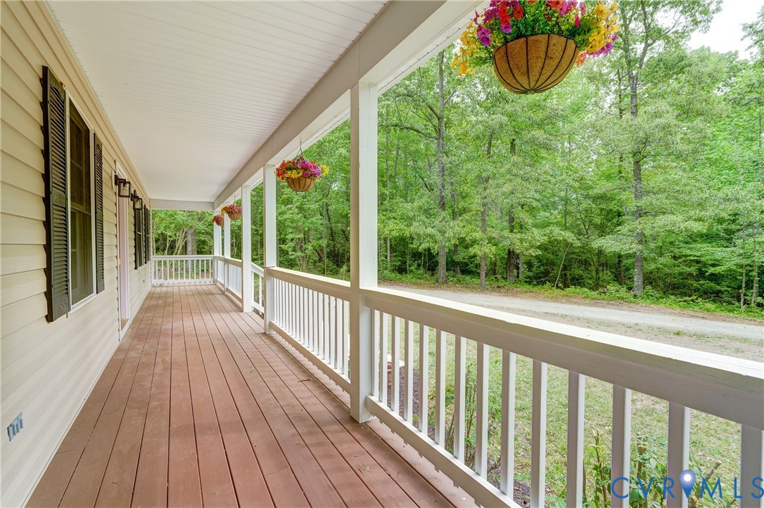 3820 Mt Pleasant Road Providence Forge, VA 23140 - Photo 26 of 40 a view of a room with wooden floor and iron fence