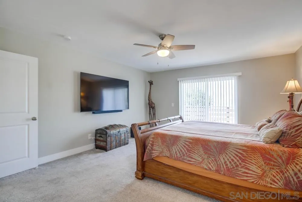 730 Pidgeon Street San Diego, CA 92114 - Photo 16 of 39 a bedroom with a bed and a flat screen tv