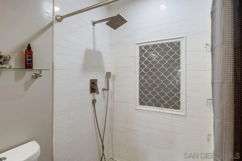 730 Pidgeon Street San Diego, CA 92114 - Photo 20 of 39 a bathroom with a shower and a toilet