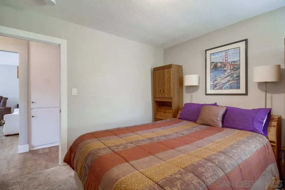 730 Pidgeon Street San Diego, CA 92114 - Photo 22 of 39 a bedroom with a large bed and a closet