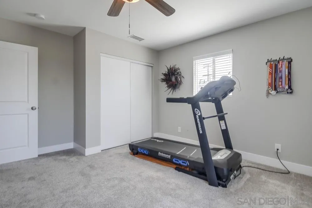 730 Pidgeon Street San Diego, CA 92114 - Photo 26 of 39 a room with gym equipment and windows