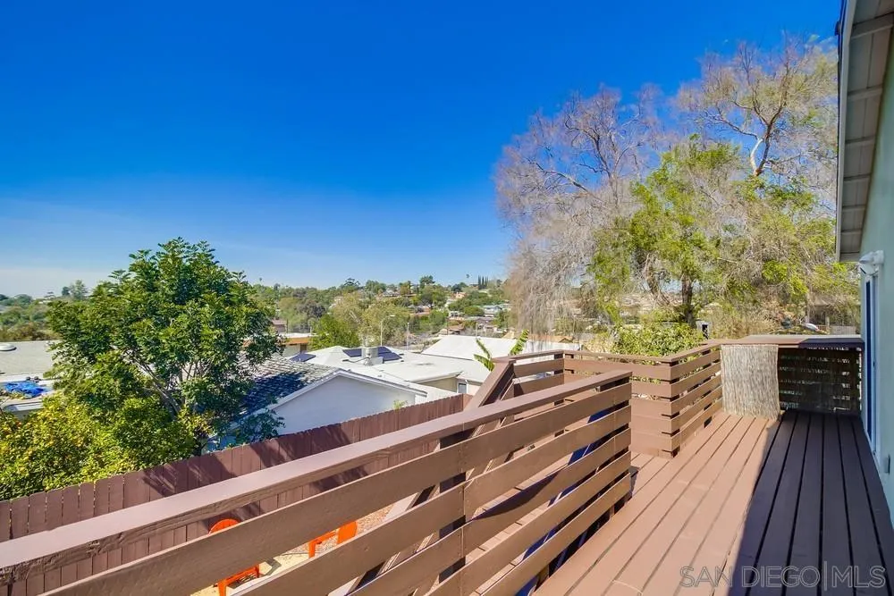 730 Pidgeon Street San Diego, CA 92114 - Photo 28 of 39 a view of balcony with wooden floor and fence