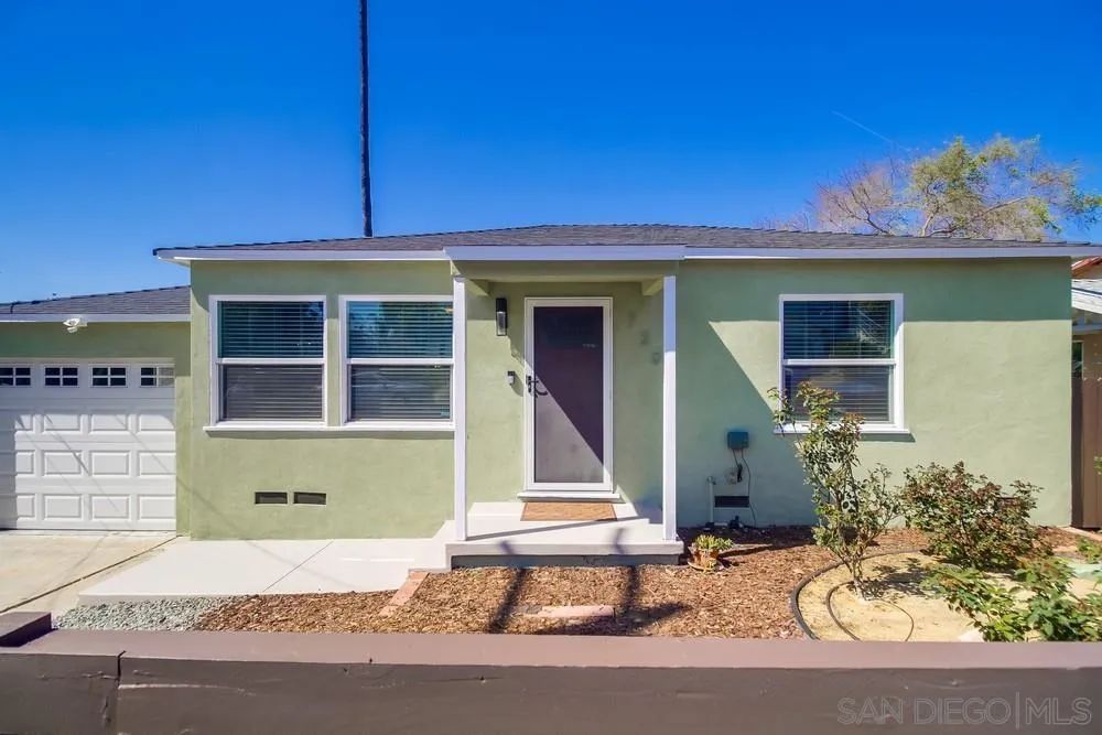 730 Pidgeon Street San Diego, CA 92114 - Photo 3 of 39 a front view of a house with a yard