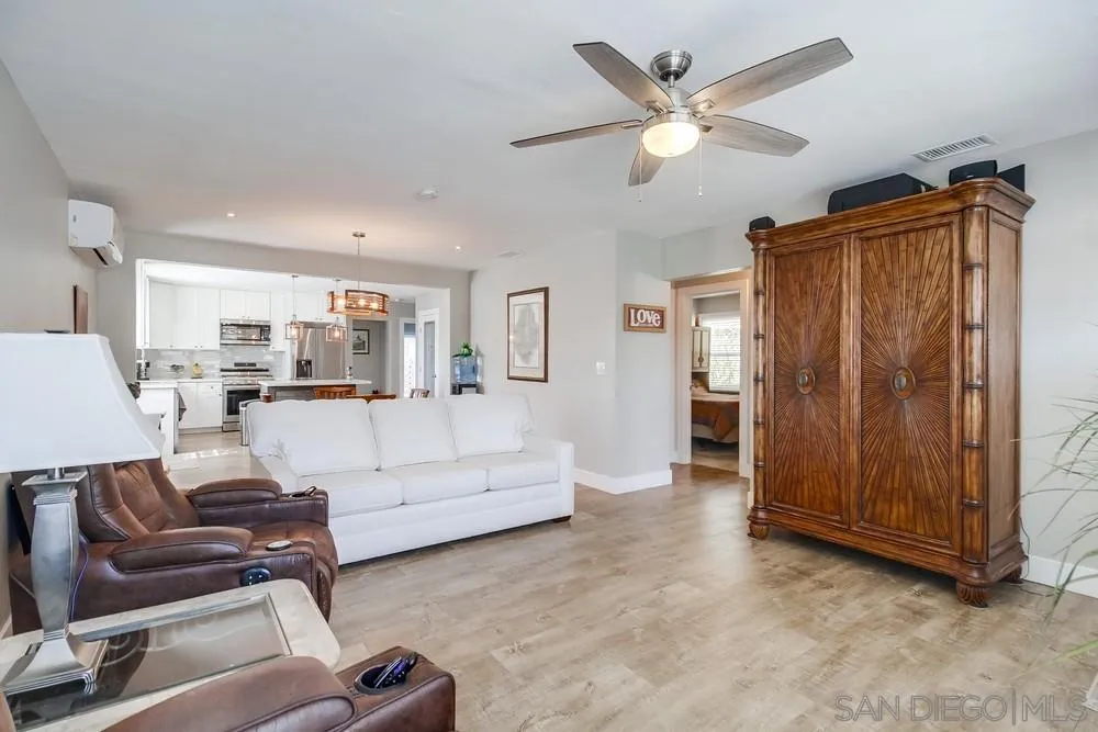 730 Pidgeon Street San Diego, CA 92114 - Photo 5 of 39 a living room with furniture a ceiling fan and a rug