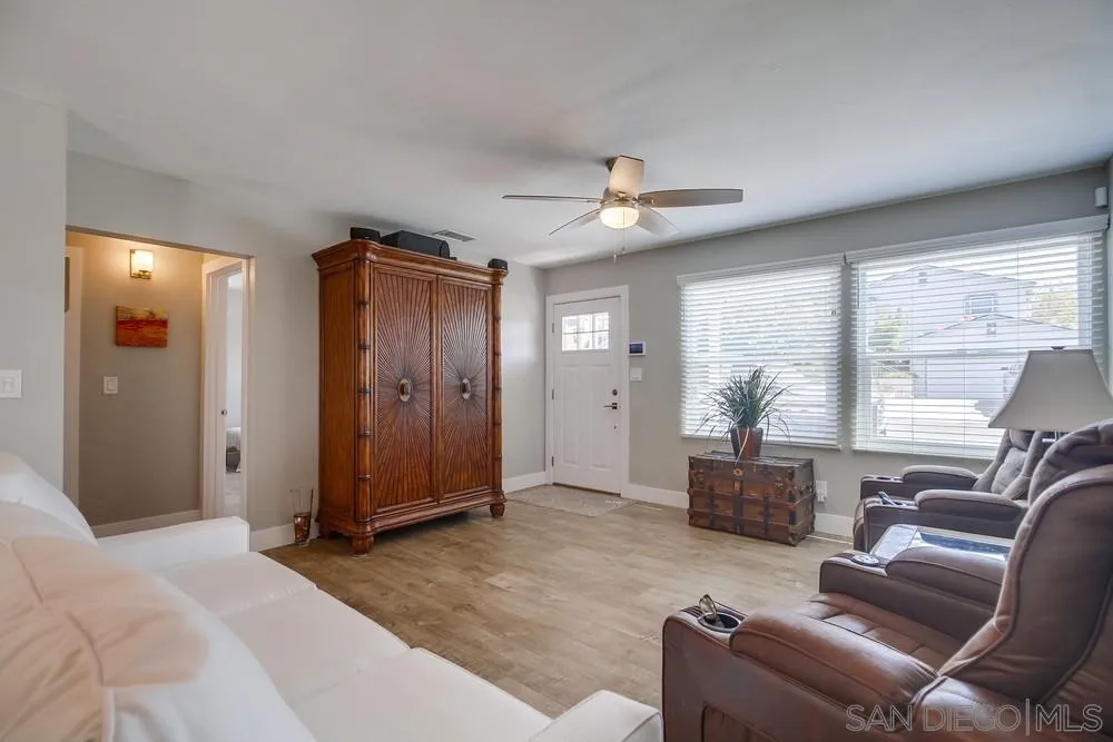 730 Pidgeon Street San Diego, CA 92114 - Photo 7 of 39 a living room with furniture and a large window