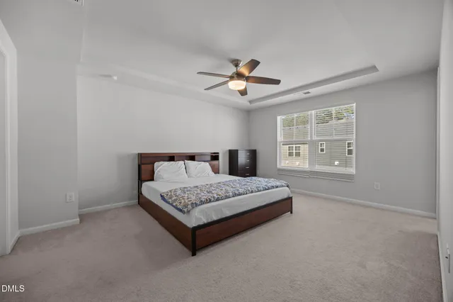 a bedroom with a bed and cabinets