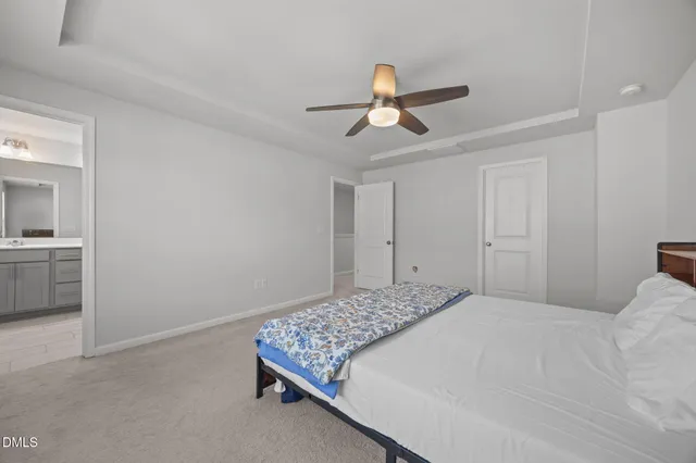 a bathroom with a shower sink and mirror