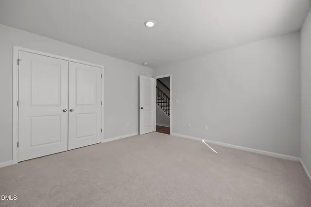 a view of an empty room and entryway
