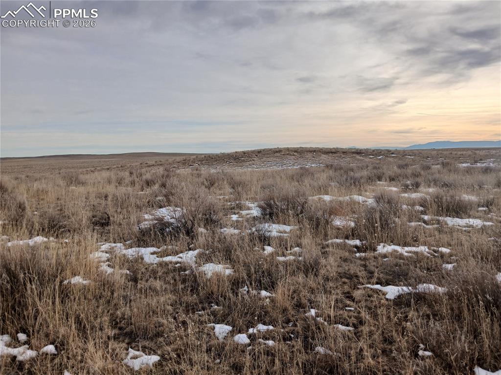 15 Squirrel Creek Road Colorado Springs, CO 80928 - Photo 2 of 12 an aerial view of house with yard and mountain view in back