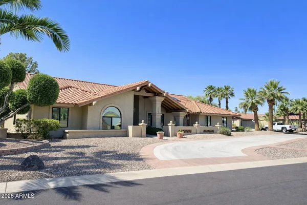 a front view of a house with a outdoor space