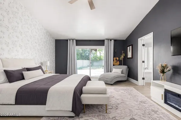 a bathroom with a granite countertop sink double vanity and a mirror