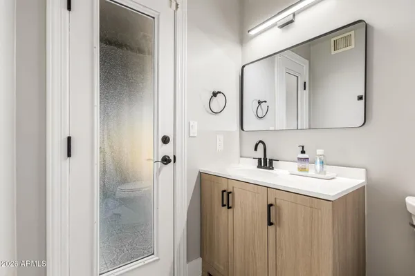 a kitchen with granite countertop a sink and a stove