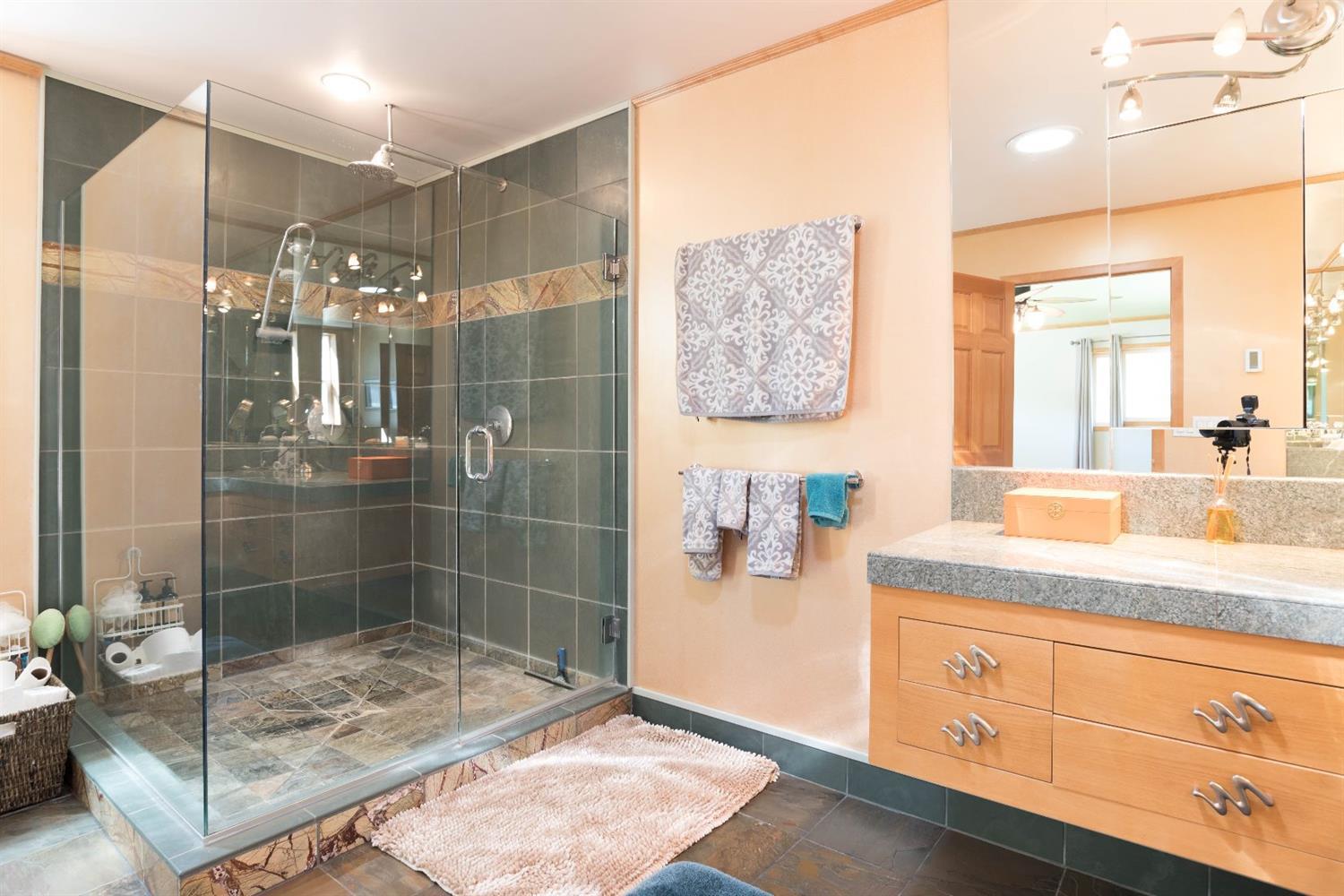 206 West Hilltop Road Talent, OR 97540 - Photo 13 of 29 a bathroom with a granite countertop sink a mirror and shower