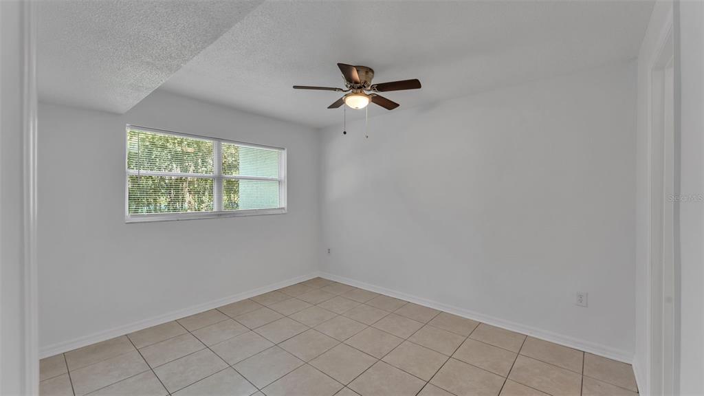 141 Fernery Road, Unit D1 Lakeland, FL 33809 - Photo 16 of 30 an empty room with windows and fan