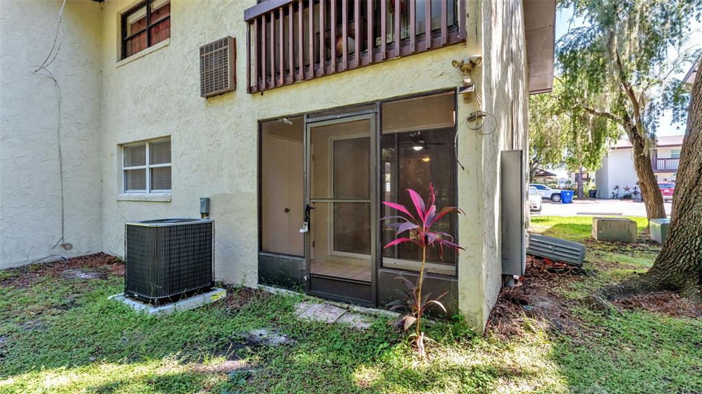 141 Fernery Road, Unit D1 Lakeland, FL 33809 - Photo 22 of 30 front view of a house with a yard