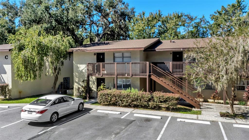 141 Fernery Road, Unit D1 Lakeland, FL 33809 - Photo 26 of 30 a car parked in front of a house