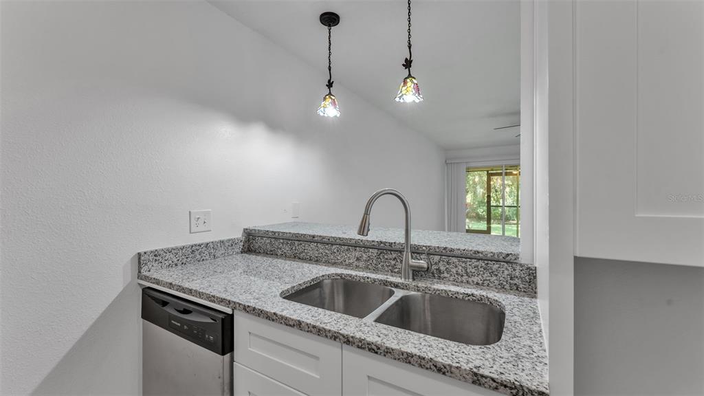 141 Fernery Road, Unit D1 Lakeland, FL 33809 - Photo 7 of 30 a view of a sink and chandelier