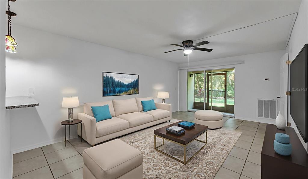 141 Fernery Road, Unit D1 Lakeland, FL 33809 - Photo 10 of 29 a living room with furniture and a large window