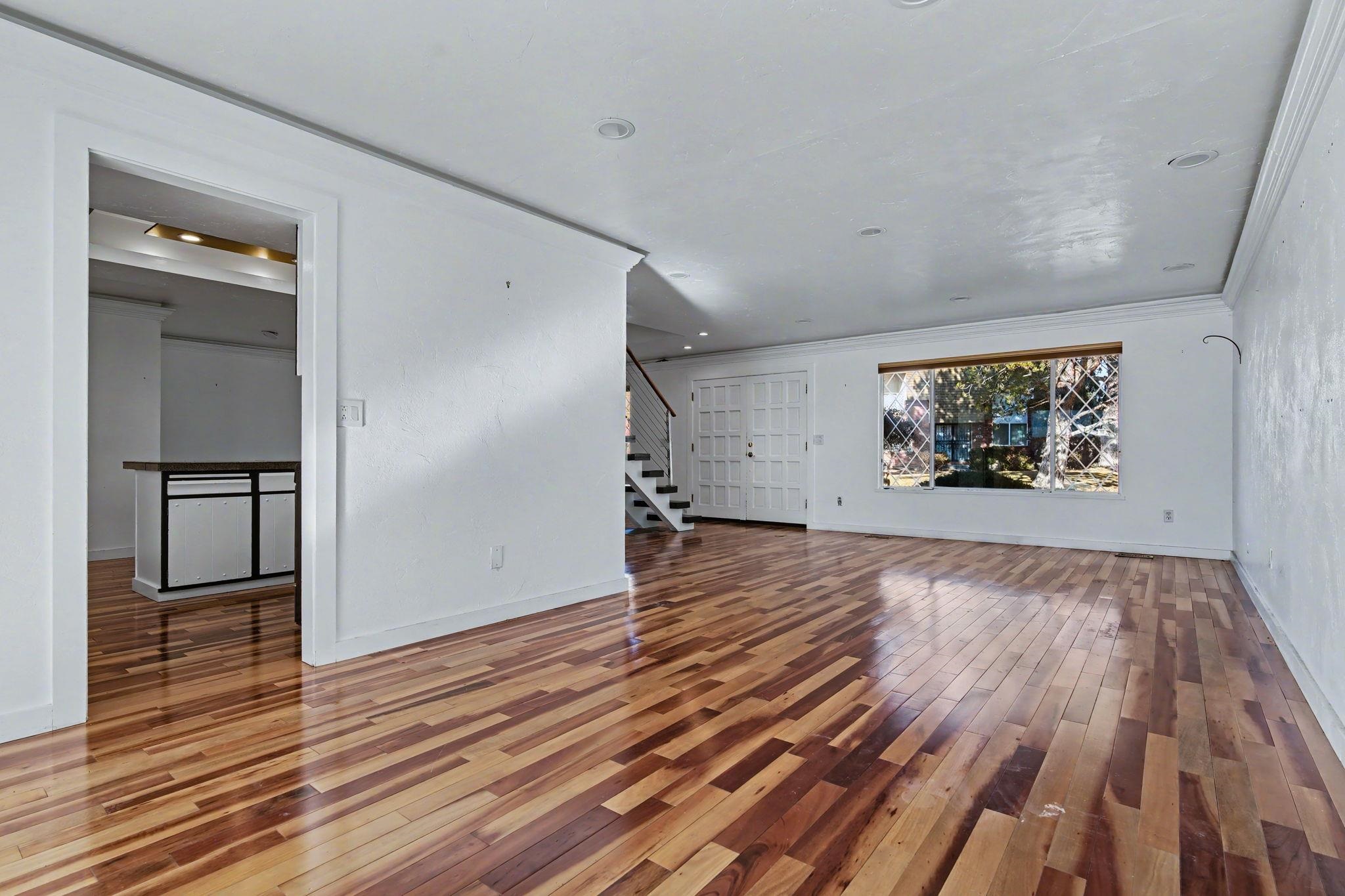 2700 G Road, Unit 12F Grand Junction, CO 81506 - Photo 5 of 24 an empty room with wooden floor and a hallway