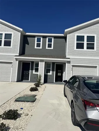 a front view of a house with outdoor space
