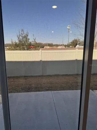 a view of a room with wooden floor and sink