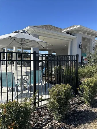 a bathroom with a granite countertop toilet and a sink
