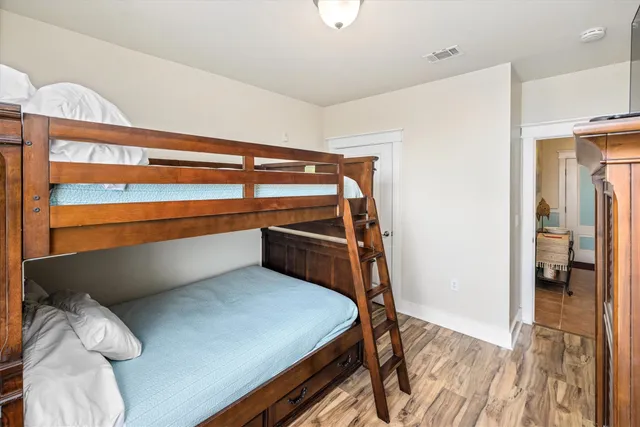 a bathroom with a granite countertop sink a toilet and a mirror