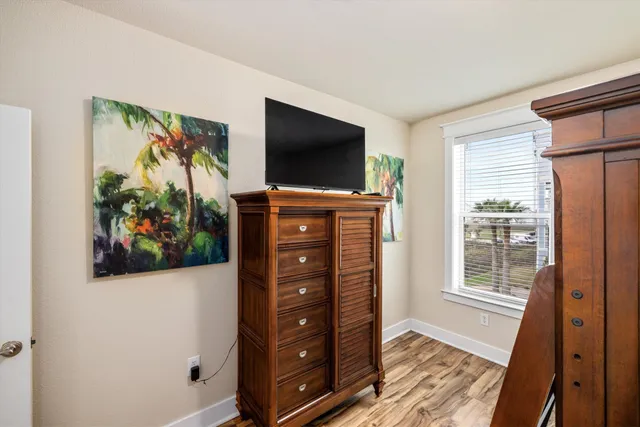 a bathroom with a granite countertop sink a toilet and a mirror