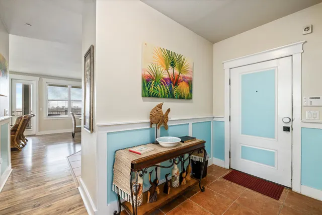 a view of a city from a balcony with chairs