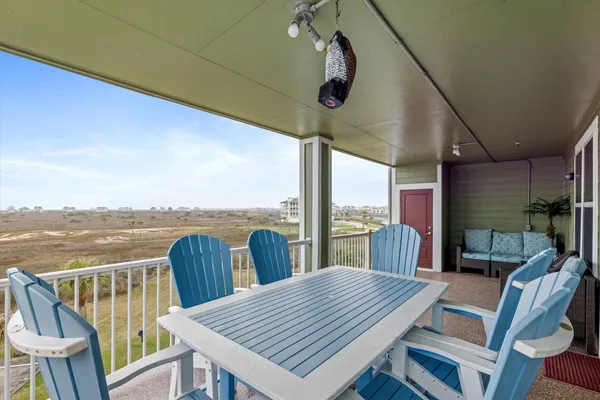 a view of a patio with a table and chairs