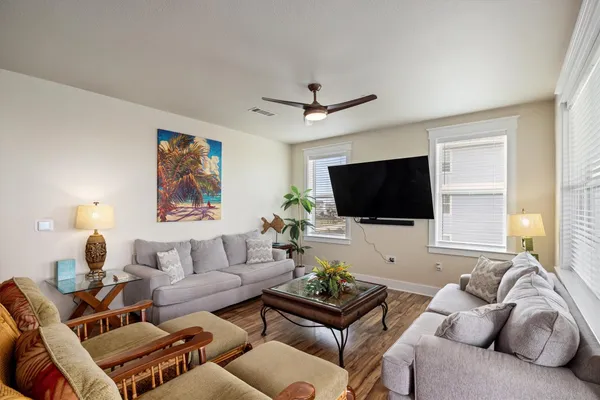 a living room with furniture and a large window