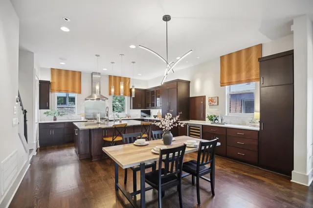 a kitchen with a stove and flowers