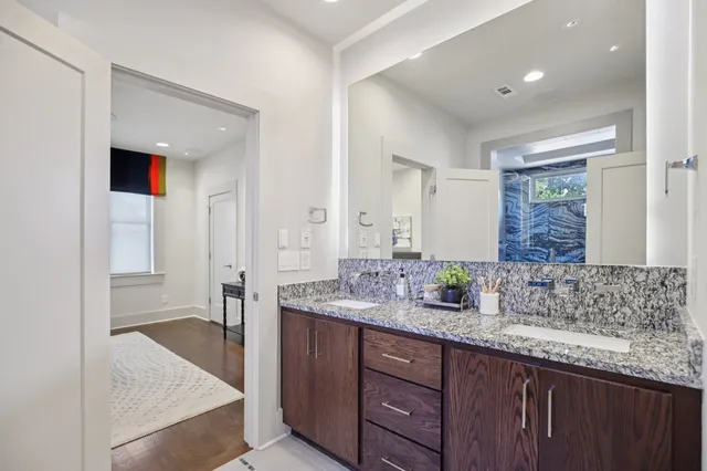 a view of a patio with table and chairs and potted plants
