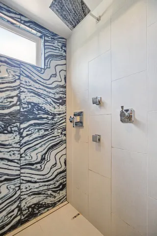 a balcony with table and chairs