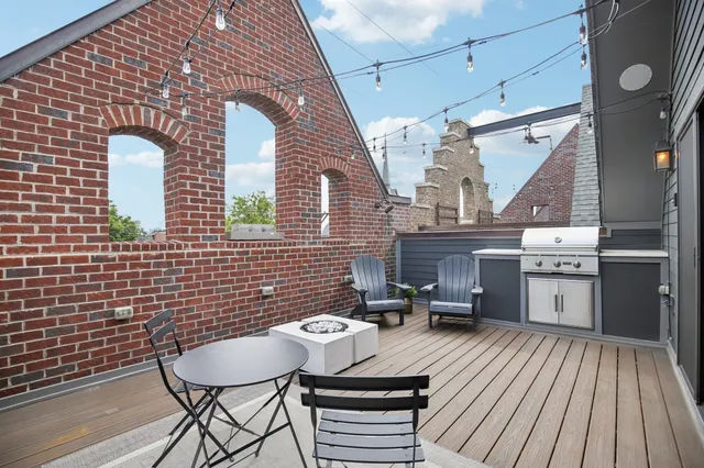 an aerial view of a house with outdoor space