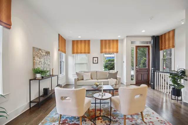 a view of a dining room with furniture window and wooden floor