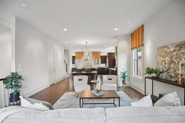 a kitchen with stainless steel appliances granite countertop sink stove and refrigerator