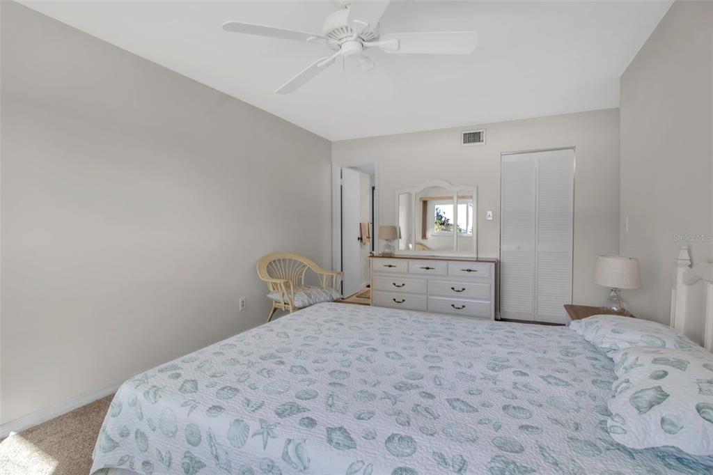 5420 Swift Road, Unit 38 Sarasota, FL 34231 - Photo 28 of 37 a bedroom with a bed and a window