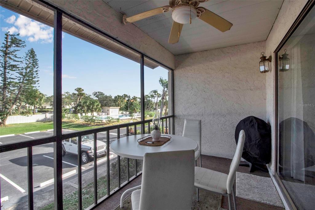 5420 Swift Road, Unit 38 Sarasota, FL 34231 - Photo 33 of 37 a view of a chairs and table in a balcony