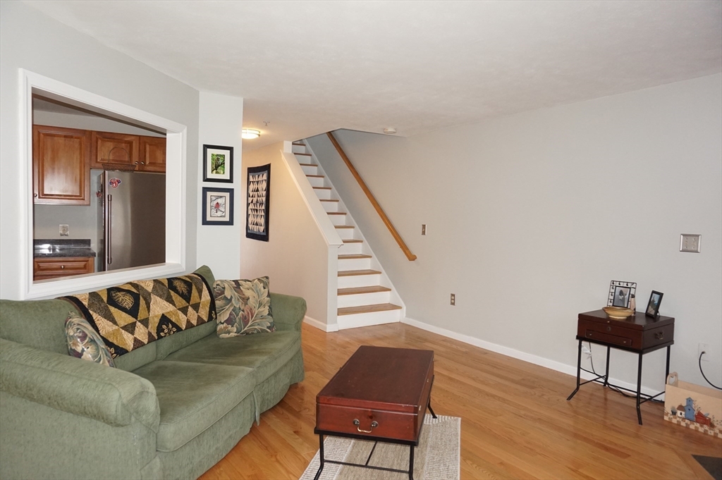 103 Bridle Cross Road, Unit 103 Fitchburg, MA 01420 - Photo 11 of 36 a living room with furniture and a window