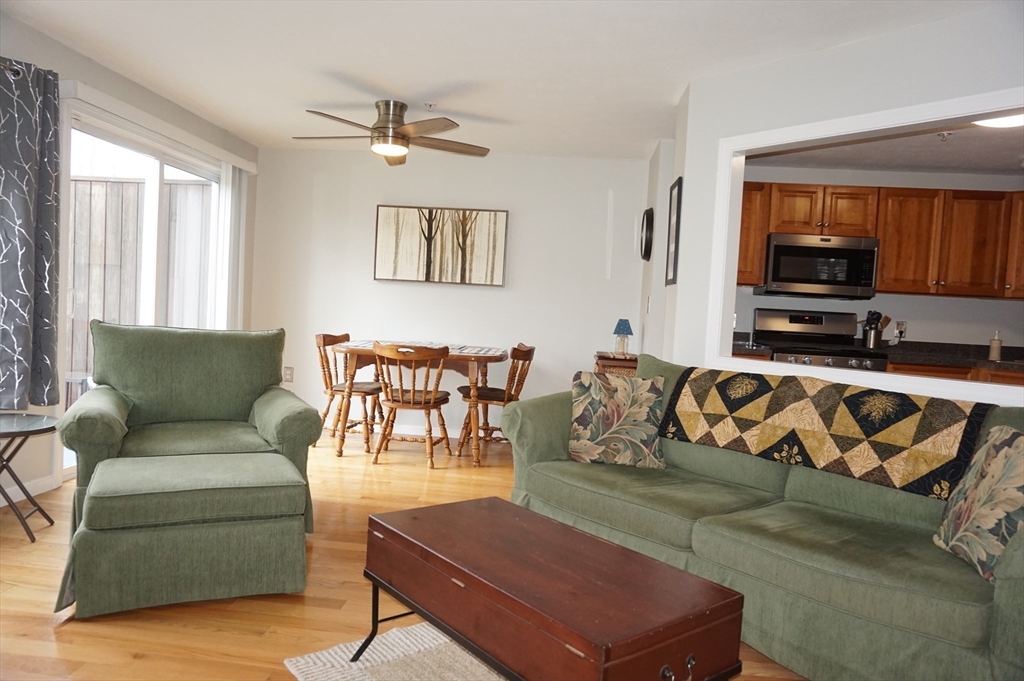 103 Bridle Cross Road, Unit 103 Fitchburg, MA 01420 - Photo 13 of 36 a living room with furniture and a view of kitchen
