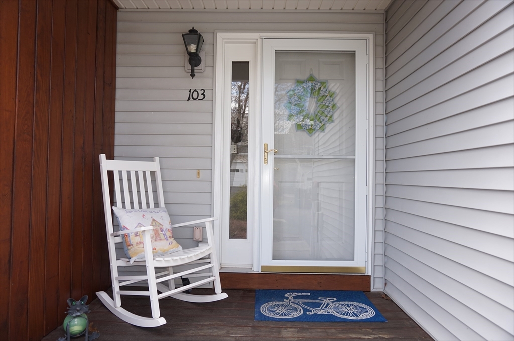 103 Bridle Cross Road, Unit 103 Fitchburg, MA 01420 - Photo 2 of 36 a view of front door with chair and wooden floor