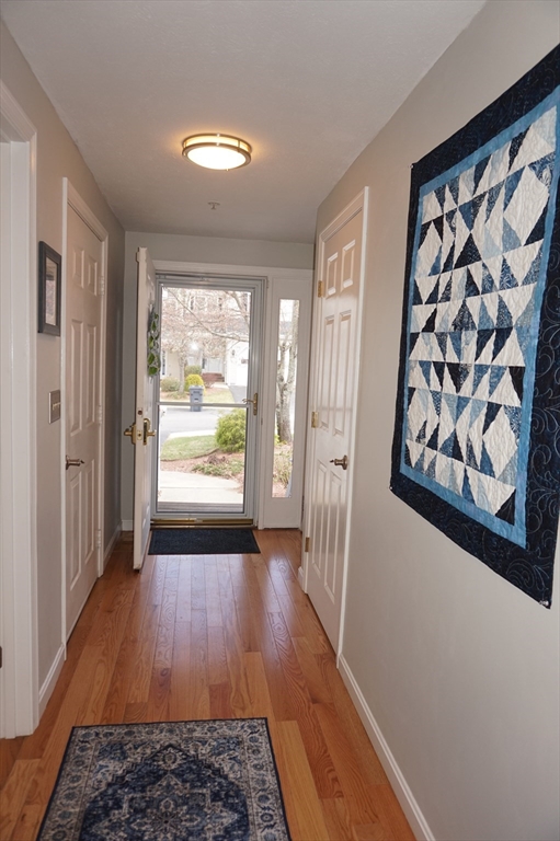 103 Bridle Cross Road, Unit 103 Fitchburg, MA 01420 - Photo 3 of 36 wooden floor in an empty room with a window